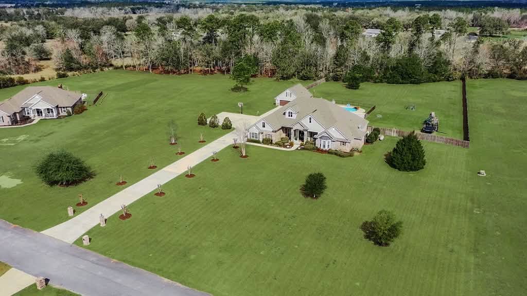 Aerial of a home on open acreage in Northwest Florida